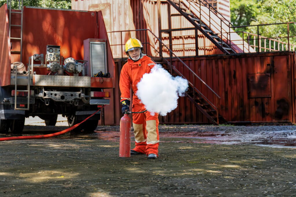 Fireman wearing fire protection suite and oxygen tank exercise hold extinguisher tank and pray